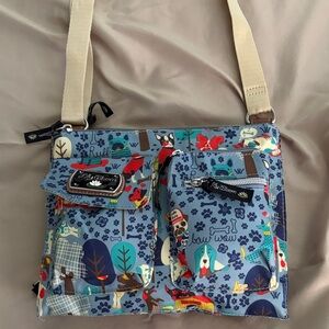 Lilly Bloom shoulder bag meas 10x8x2 in 3 large zipper compartments.